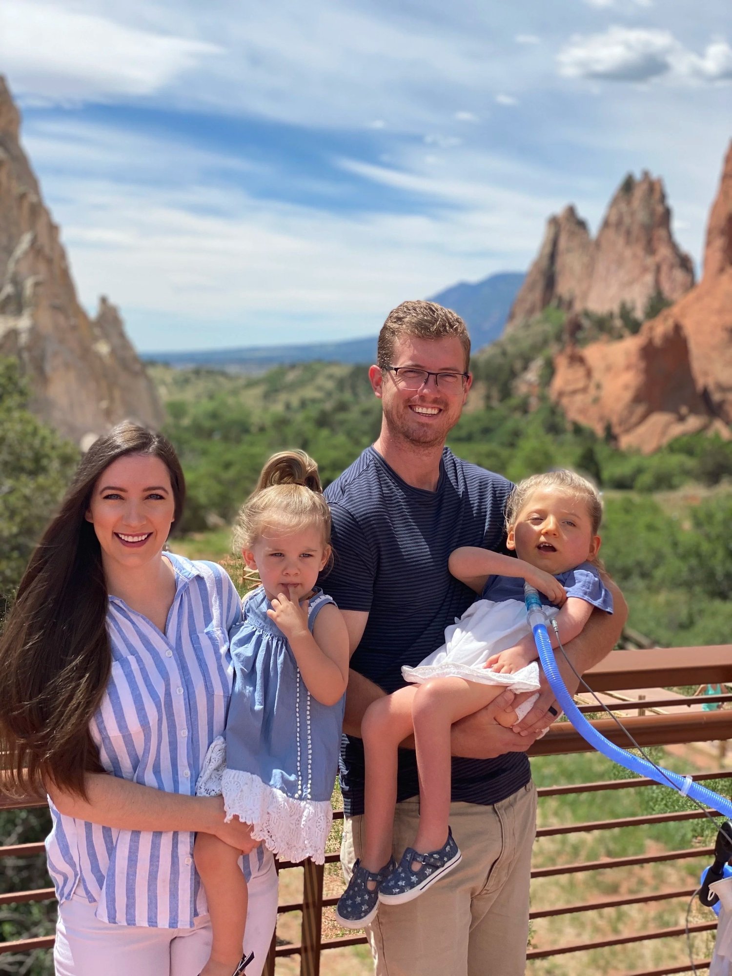 Lillian with her parents and sister on a family trip